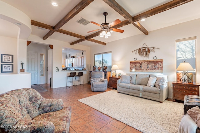 tiled living room with coffered ceiling, ceiling fan, and beamed ceiling