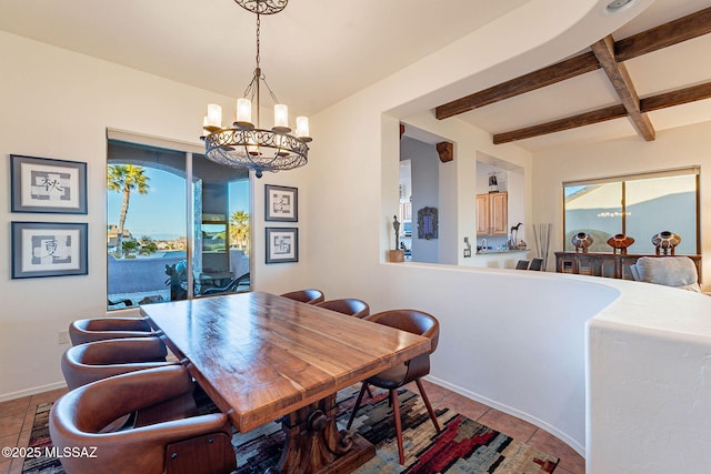 dining area with beamed ceiling and an inviting chandelier