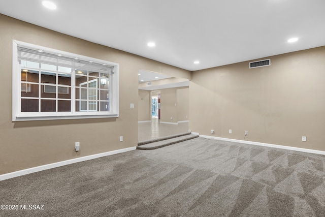 unfurnished living room featuring carpet