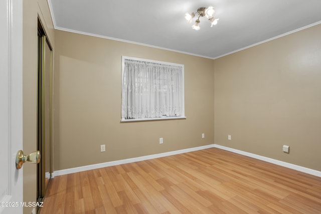 unfurnished bedroom featuring ornamental molding, light hardwood / wood-style floors, and a closet