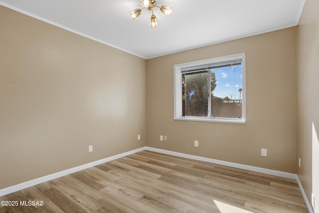 spare room with light hardwood / wood-style flooring