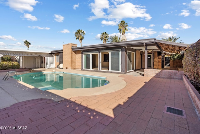 view of swimming pool featuring a patio area