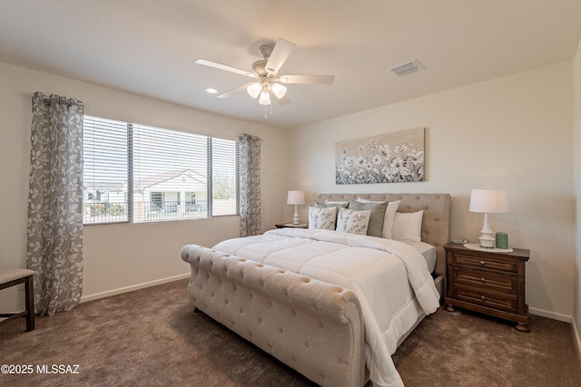 bedroom featuring ceiling fan and dark carpet