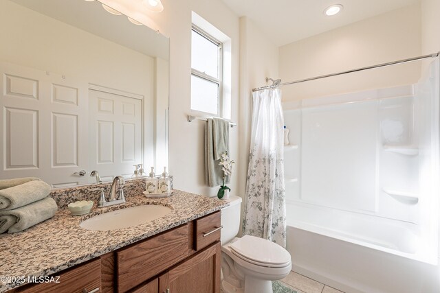 full bathroom featuring tile patterned flooring, vanity, shower / bath combo, and toilet