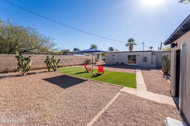 view of yard with a fenced backyard