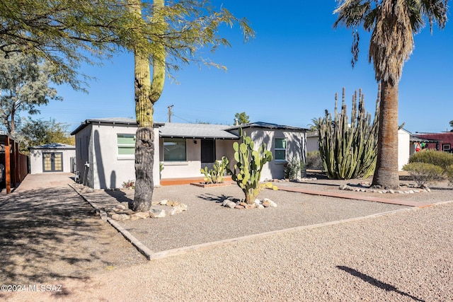 view of front of house featuring driveway and stucco siding