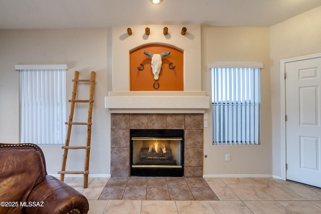 living room with a fireplace and tile patterned flooring