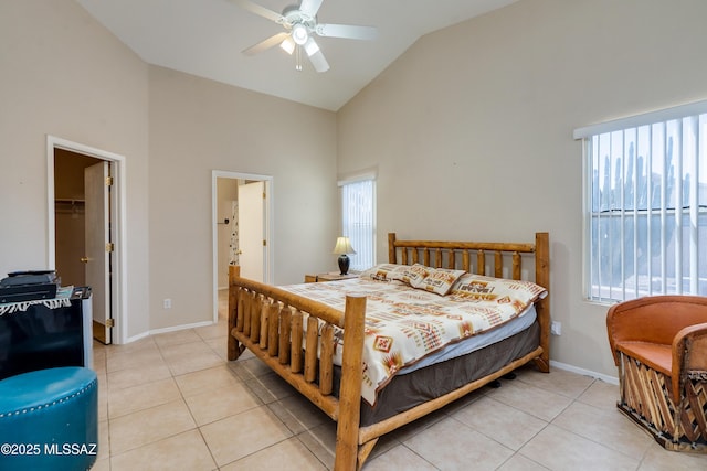 bedroom with multiple windows, a spacious closet, and light tile patterned flooring