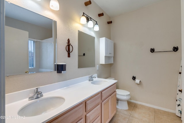 bathroom featuring tile patterned flooring, vanity, a shower with curtain, and toilet