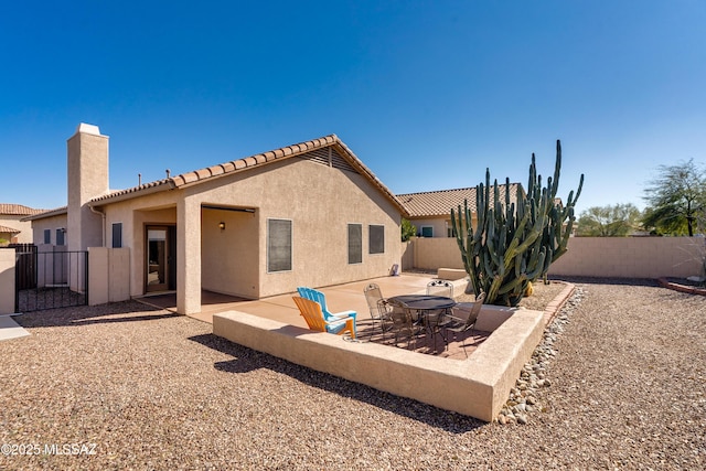 rear view of house featuring a patio area