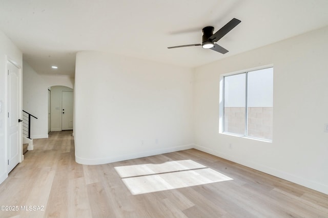 unfurnished room featuring light hardwood / wood-style flooring and ceiling fan