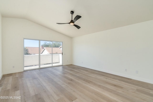 empty room with lofted ceiling, light hardwood / wood-style flooring, and ceiling fan