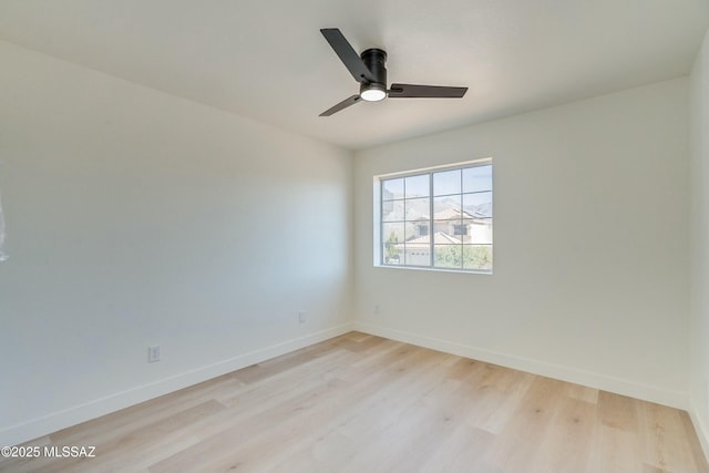 spare room featuring ceiling fan and light wood-type flooring