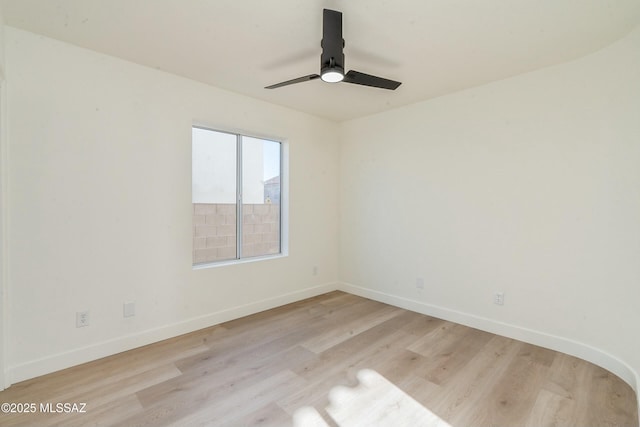 spare room featuring ceiling fan and light wood-type flooring