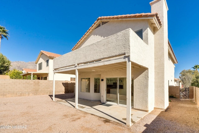 rear view of property with a patio