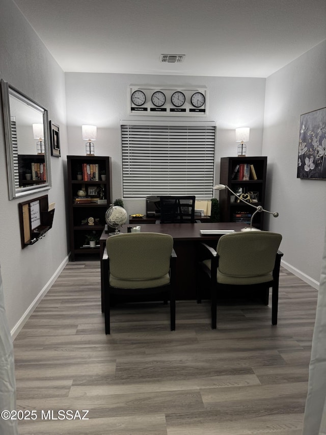 dining area featuring hardwood / wood-style flooring