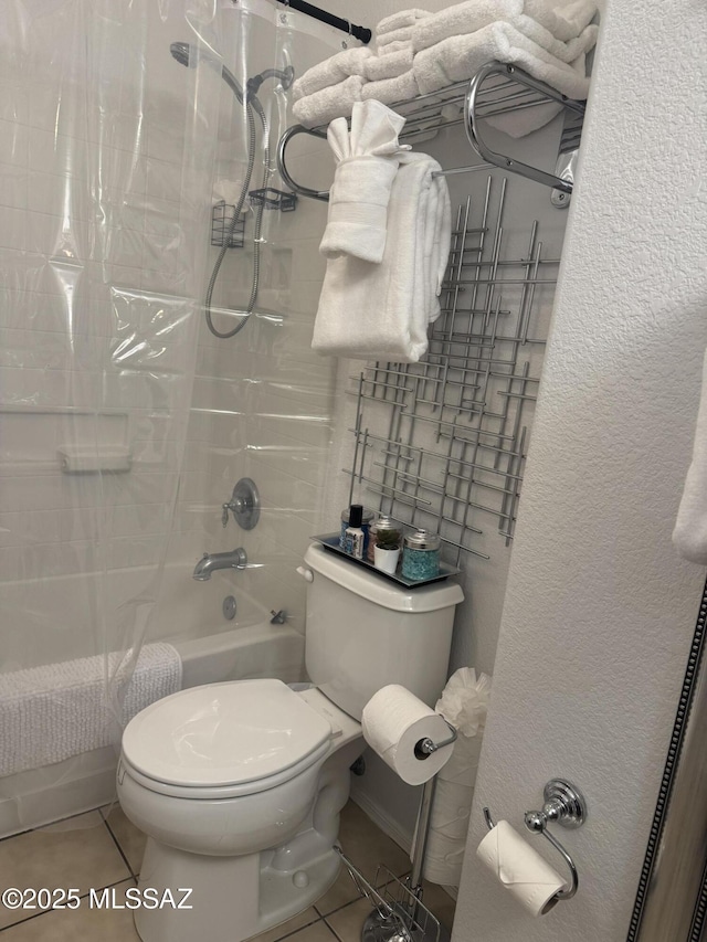 bathroom with tile patterned flooring, toilet, and shower / bath combo