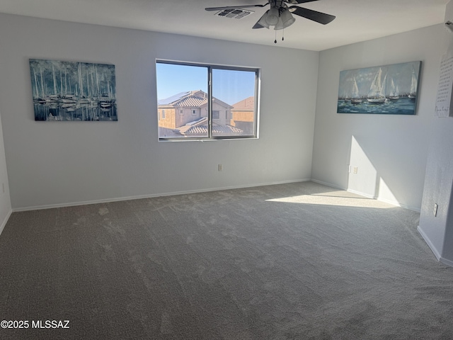 unfurnished room with ceiling fan and carpet flooring