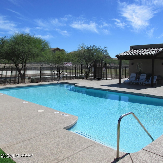 view of swimming pool with a patio area