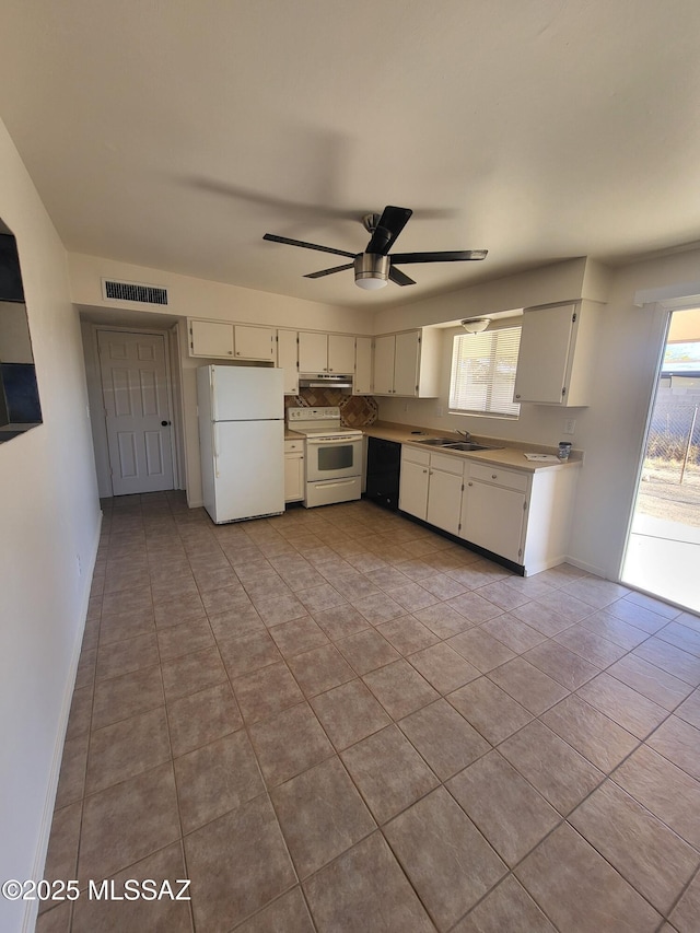 kitchen featuring white cabinetry, sink, light tile patterned floors, ceiling fan, and white appliances