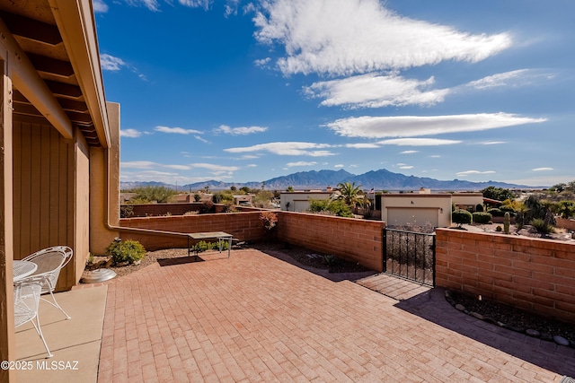 view of patio / terrace featuring a mountain view