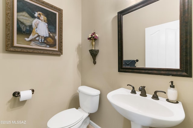 bathroom with sink and toilet