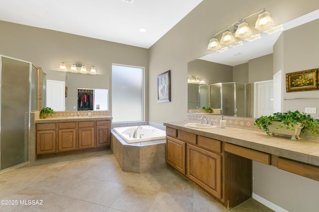 bathroom featuring vanity, shower with separate bathtub, tile patterned flooring, and backsplash