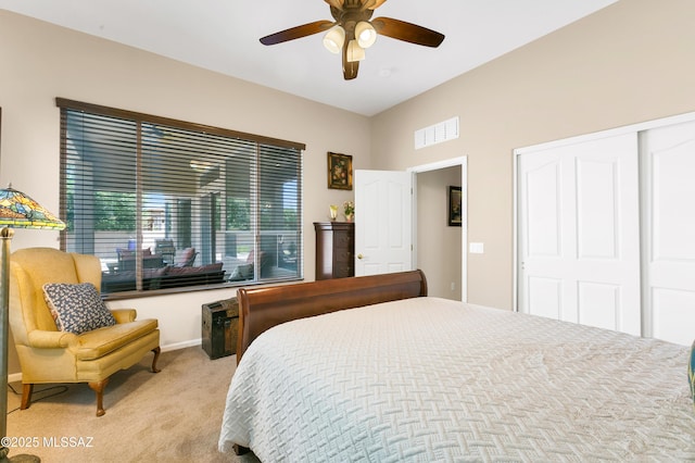 carpeted bedroom with a closet and ceiling fan