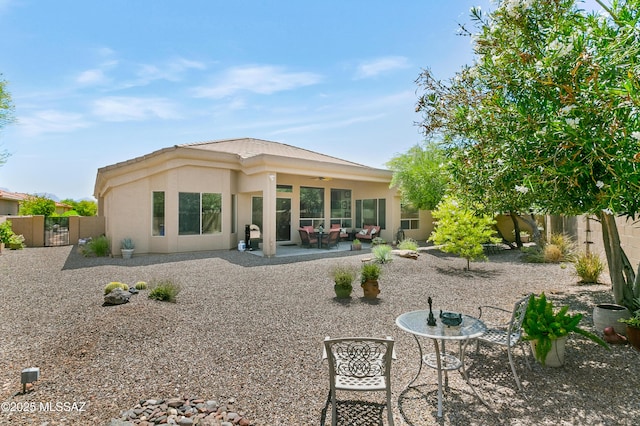 back of house with a patio area