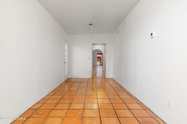 hallway with light tile patterned floors