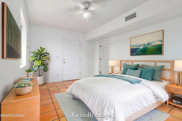 bedroom with ceiling fan and light tile patterned floors