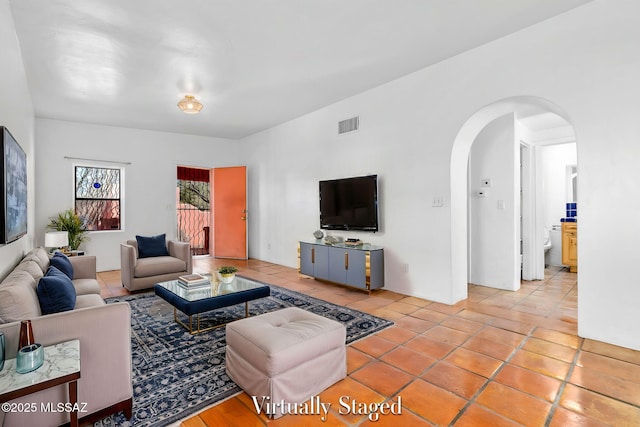 living room with light tile patterned floors