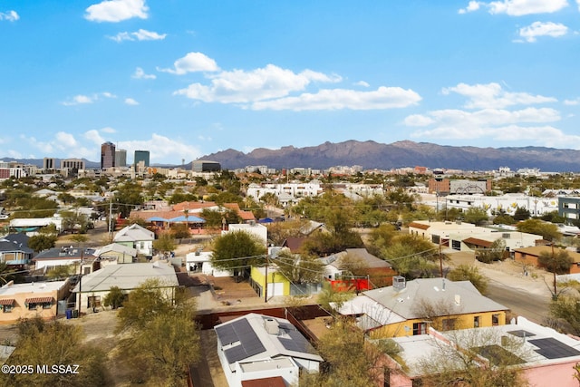 birds eye view of property featuring a mountain view