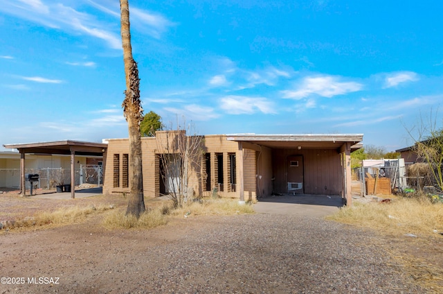 view of front of home with a carport