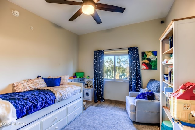 bedroom featuring ceiling fan and light hardwood / wood-style floors