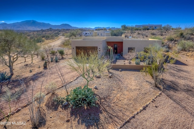 view of front facade featuring a mountain view