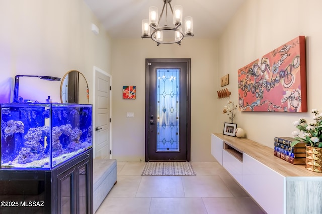 entrance foyer featuring light tile patterned flooring and an inviting chandelier