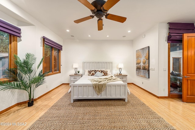 bedroom with a ceiling fan, light wood-type flooring, baseboards, and recessed lighting