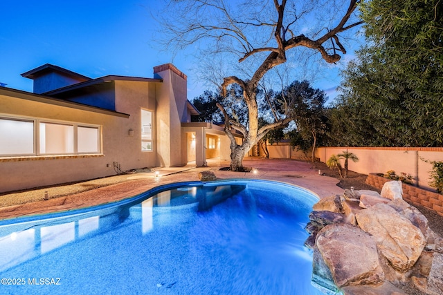 view of swimming pool featuring a fenced in pool, a patio area, and a fenced backyard