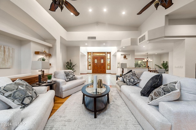 living room featuring recessed lighting, visible vents, and ceiling fan with notable chandelier