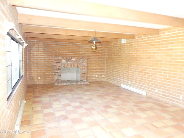 unfurnished living room featuring brick wall, a brick fireplace, and beam ceiling