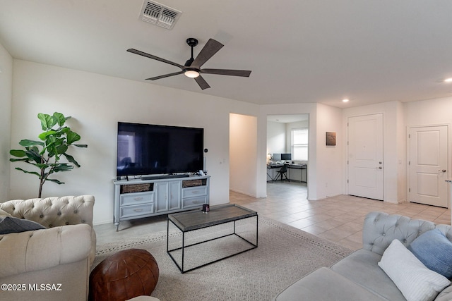 living room featuring light tile patterned flooring and ceiling fan