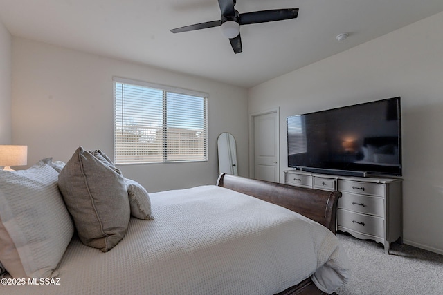 carpeted bedroom featuring ceiling fan