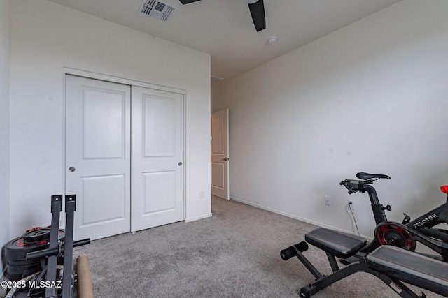 workout area featuring carpet floors and ceiling fan