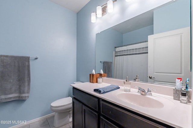 bathroom featuring tile patterned flooring, vanity, walk in shower, and toilet