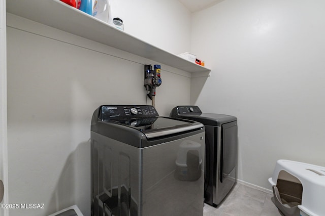 laundry area with separate washer and dryer