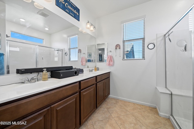 bathroom with vanity, tile patterned floors, and walk in shower