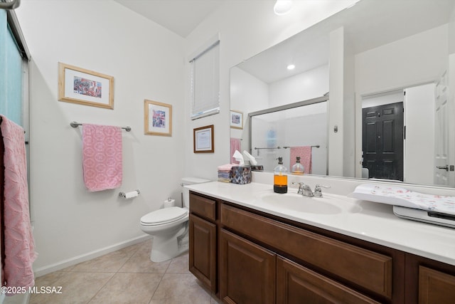 bathroom featuring vanity, tile patterned flooring, a shower with shower door, and toilet