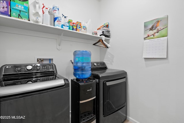 clothes washing area featuring washing machine and clothes dryer