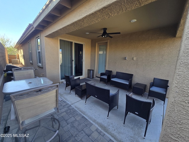 view of patio featuring outdoor lounge area and ceiling fan